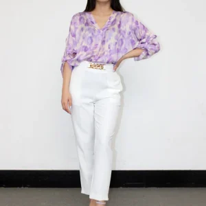 Pantalone con accessorio applicato