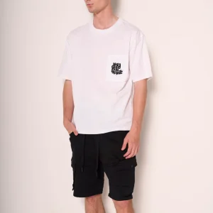 T-shirt bianca "Good Vibes" con taschino